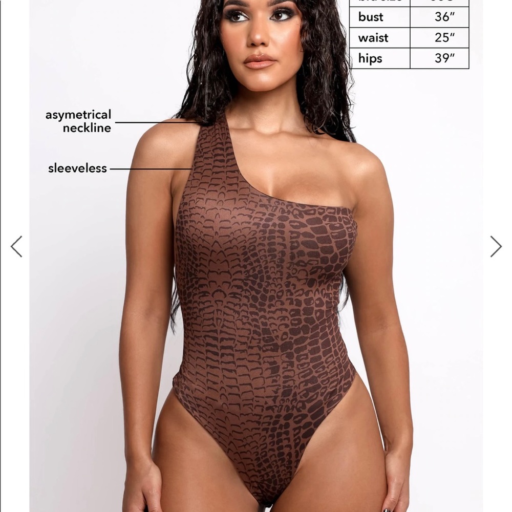 NWT Crocodile bodysuit in a size small.